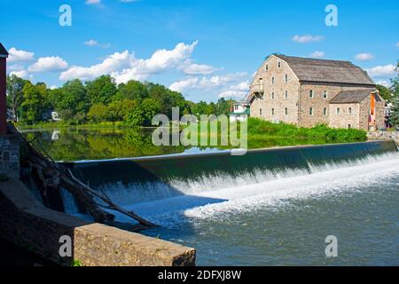 Scenic view of the exterior of the Hunterdon Art Museum in Clinton, New Jersey, on a sunny day, with a waterfall in the foreground -02 Stock Photo