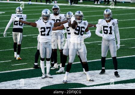 December 6, 2020, Las Vegas Raiders defensive end Clelin Ferrell (96)  reacts to his strip of New York Jets quarterback Sam Darnold (14) with  teammates during the NFL game between the Las Vegas Raiders and the New  York Jets at MetLife Stadium in