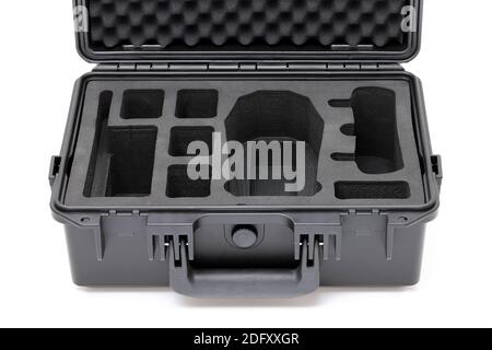 Open black hard plastic case with foam inside isolated on white background Stock Photo