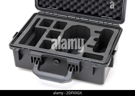 Open black hard plastic case with foam inside isolated on white background Stock Photo