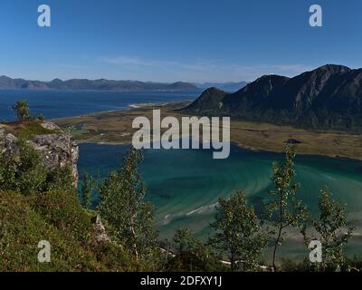 Stunning panoramic view of fjord Grunnførfjorden with shallow blue and turquoise colored water on the northern coast of Austvågøya island, Lofoten. Stock Photo