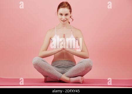 Woman practicing yoga Stock Photo