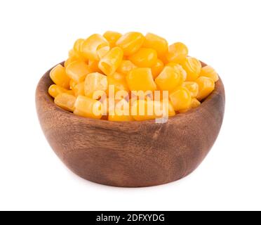 Canned sweet corn in wooden bowl, isolated on white background. Pickled corn. Stock Photo