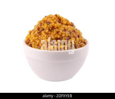 Grain mustard sauce in bowl, isolated on white background. Mustard beans. Stock Photo
