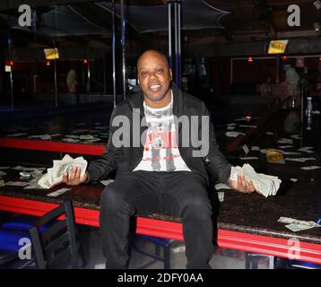 Anaheim, California, USA. 5th December, 2020. Rapper Too Short holds money in each hand at the filming Invinceable's latest music video 'Rain Dance' featuring Too Short at the Angels Cabaret in Anaheim, California.  Credit: Sheri Determan Stock Photo