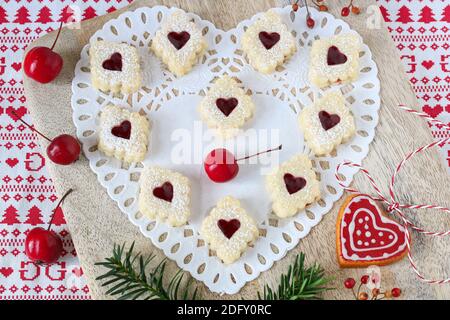 christmas biscuits Spitzbuben on wooden board Stock Photo