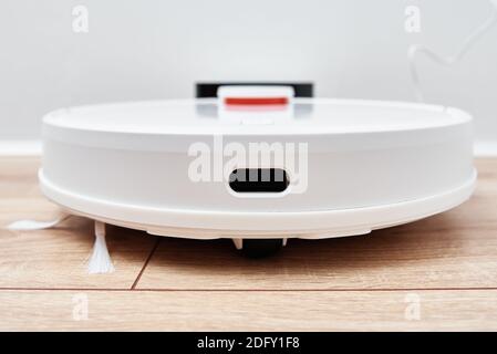 Robot vacuum cleaner return to the charge after cleaning room Modern smart household Stock Photo