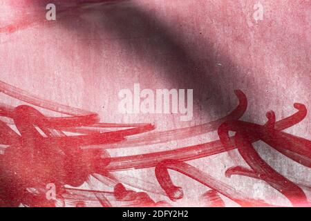 Dusty red metal surface with chaotic brush strokes. Patterned on a dusty countertop. Texture background Stock Photo