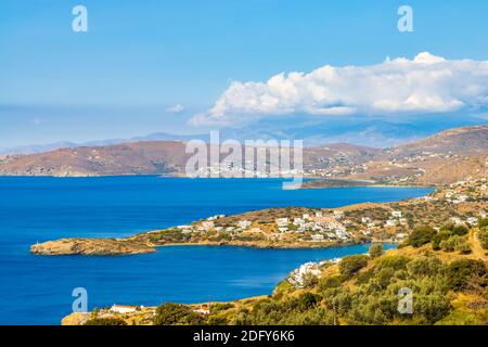 View over the bays of Batsi and Gavrion on the Greek Cyclades island of Andros with the island of Evia on the horizon Stock Photo