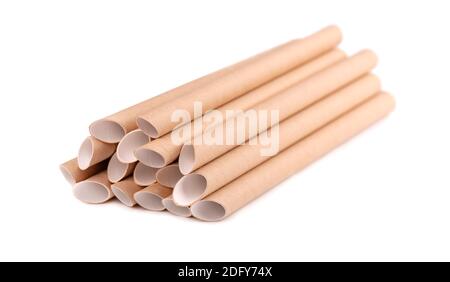 Brown paper drinking straws, isolated on white background. Eco-friendly paper straw, environmental consciousness concept. Close up. Stock Photo