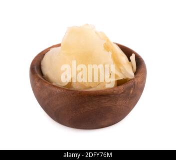 Pickled ginger slices in wooden bowl, isolated on white background. Stock Photo