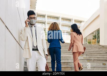 Serious entrepreneur talking on phone Stock Photo