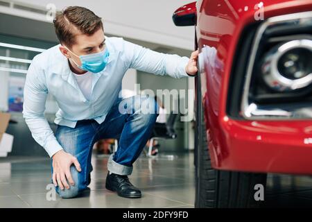 Man checking new car tires Stock Photo