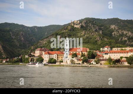 Durnstein Abbey and Durnstein castle ruins on the hill in the small town of Durnstein across the Danube river in Austria. Stock Photo