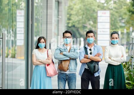 Unhappy people in medical masks Stock Photo