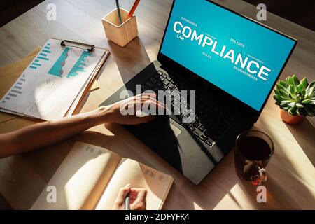 Compliance concept with icons and diagrams. Regulations, law, standards, requirements, audit. Concept on device screen