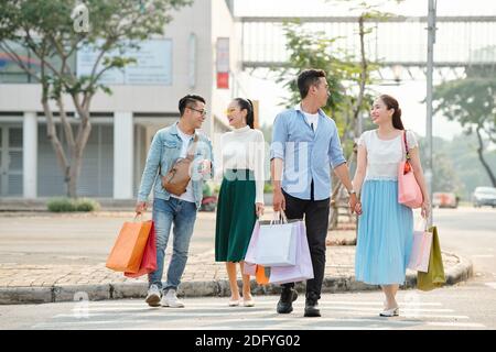 Young couple with shopping bags Stock Photo