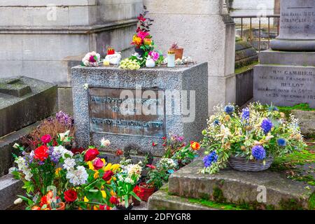 Grave of Jim Morrison  at Pere Lachaise in Paris . Gravestone of James Douglas Morrison singer of The Doors Stock Photo