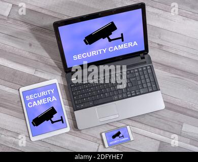 Security camera concept shown on different information technology devices Stock Photo