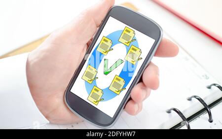 Document validation concept shown on a smartphone screen Stock Photo