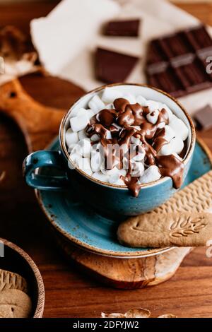 Close-up of hot chocolate with marshmallows on the table. Autumn or winter cozy still life. Stock Photo