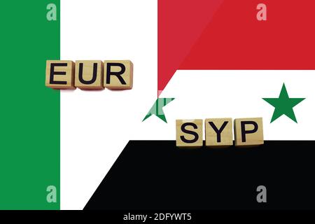 Italy and Syria currencies codes on national flags background. International money transfer concept Stock Photo