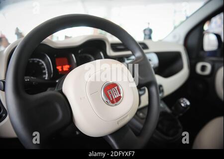 Bucharest, Romania - June 20, 2012: Details from inside a Fiat car with the steering wheel and the Fiat logo. Stock Photo