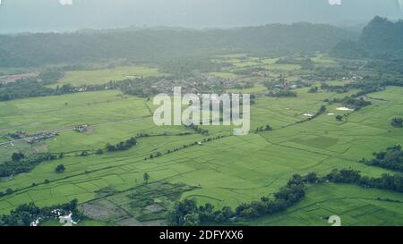 Beautiful Sunset Views of Mountainous in Vang Vieng City which Popular for Tourists. View of Rice Fields Under the Mountains. Stock Photo