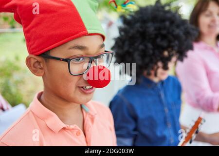 Children in carnival in funny disguise before the talent show Stock Photo