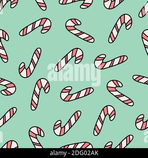 Green seamless pattern with candy canes. Christmas and New Year design. Stock Vector