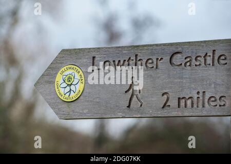 Wooden fingerpost sign on the Ullswater Way Lowther Castle loop in the English Lake District Stock Photo