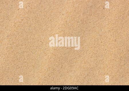 Fine sand, yellow sand background on the beach. Stock Photo