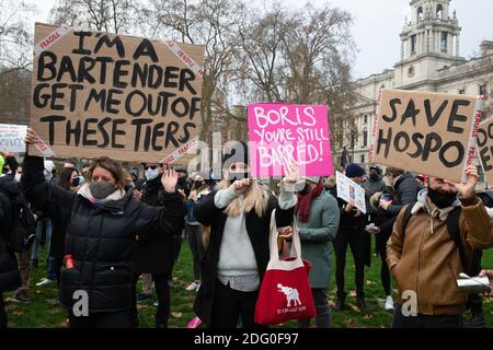 London, UK. 7th Dec, 2020. Hospitalty workers demonstrate outside Parliament against the governments tier system. Credit: Mark Thomas/Alamy Live News Stock Photo