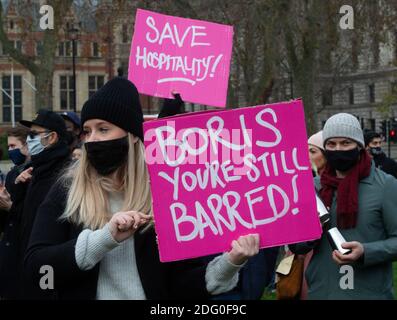 London, UK. 7th Dec, 2020. Hospitalty workers demonstrate outside Parliament against the governments tier system. Credit: Mark Thomas/Alamy Live News