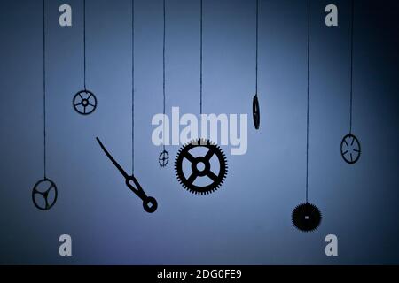 Gears hours suspended in space on a thread Stock Photo
