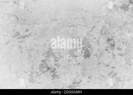 Texture, background of an old white concrete wall with scratches and damages Stock Photo