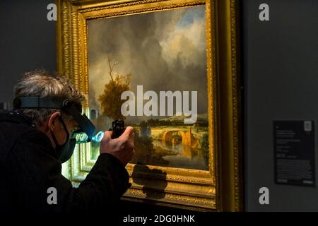 https://l450v.alamy.com/450v/2dg0hnk/london-uk-7-december-2020-a-visitor-inspects-landscape-with-a-cottage-and-stone-bridge-under-a-cloudy-sky-by-jacob-isaacksz-van-ruisdael-est-800k-12m-preview-of-sothebys-upcoming-christmas-sale-series-of-old-masters-and-treasures-paintings-and-objects-spanning-800-years-the-sales-will-be-at-sothebys-new-bond-street-gallery-credit-stephen-chung-alamy-live-news-2dg0hnk.jpg