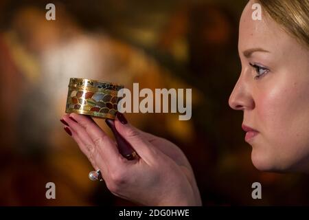 London, UK.  7 December 2020. A staff member poses with 'A very rare gold and pietra dura 'Steinkabinett', complete with secret compartment and explanatory booklet' by Christian Gottlieb Stiehl', circa 1770, (Est. £700-£1m). Preview of Sotheby’s upcoming Christmas Sale Series of Old Masters and Treasures - paintings and objects spanning 800 Years.  The sales will be at Sotheby’s New Bond Street gallery. Credit: Stephen Chung / Alamy Live News Stock Photo