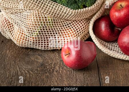 Fresh apples in an ecological reusable mesh bag made of organic cotton Stock Photo