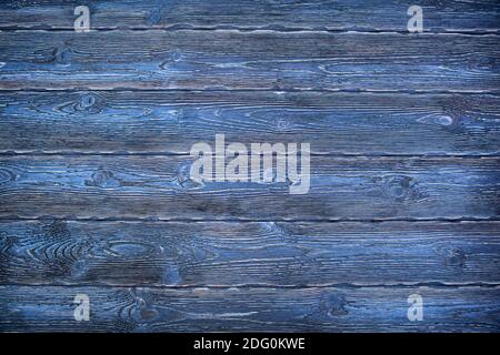 A beautiful blue universal natural background from textured coniferous wooden boards. Aged boards by firing and brushing Stock Photo