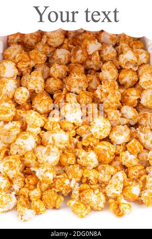 Sweet caramel candy popcorn rolling from a basket white background Stock Photo