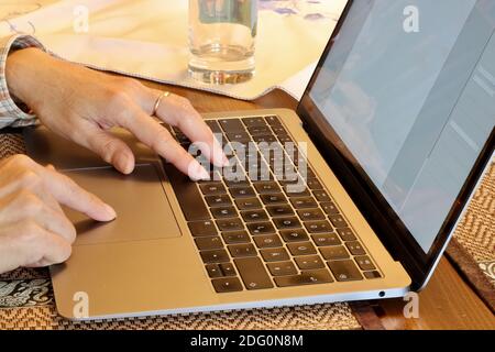 hands working on laptop Stock Photo
