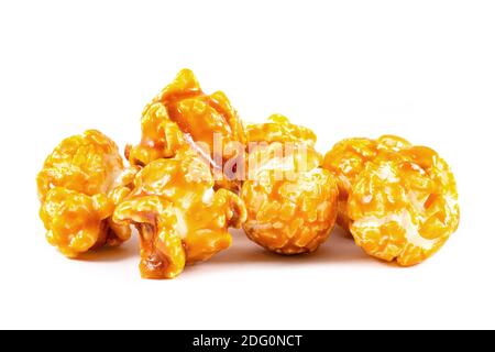 Sweet caramel candy popcorn pieces macro on white background Stock Photo