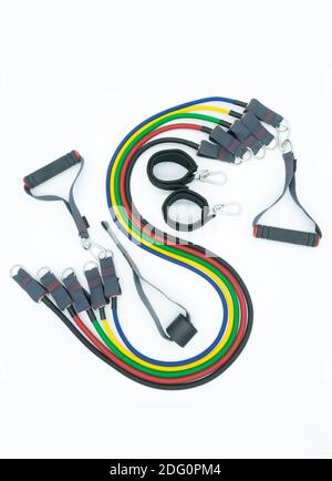 A set of colorful resistance bands,door anchor and foot ring isolated on the white background