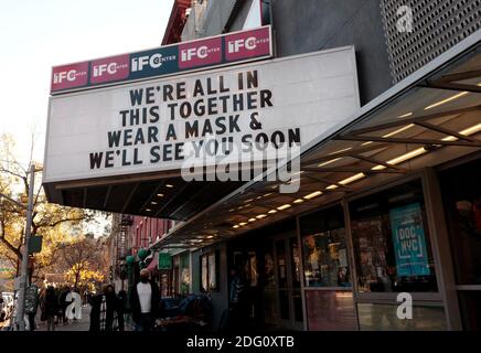 marquee sign at the IFC Center, an art house movie theatre in greenwich village, nyc, advising to wear a mask during coronavirus or covid-19 pandemic