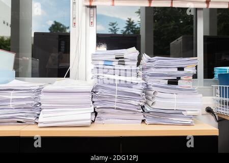 Close up of business documents stack on desk , report papers stack Stock Photo