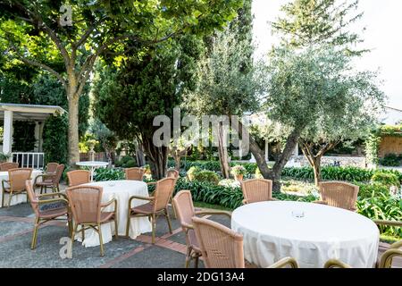 The stunning garden of Villa Eva in the town of Ravello Italy. A renowned wedding venue and privately owned villa. Garden table and chairs on terrace. Stock Photo