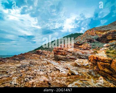 coast rock mountain at Khao Laem Ya National Park Rayong Thailand against blue sky background.