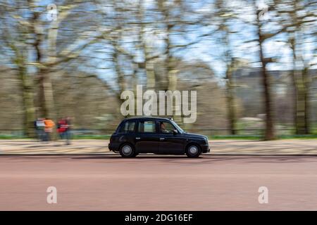 LONDON, UK - MARCH 25, 2019: Panning shot of TX4 taxicab manufactured by The London Taxi Company Stock Photo