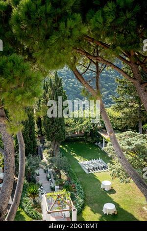 The stunning garden of Villa Eva in the town of Ravello Italy. A renowned wedding venue and privately owned villa. Landscaped garden and tall trees. Stock Photo